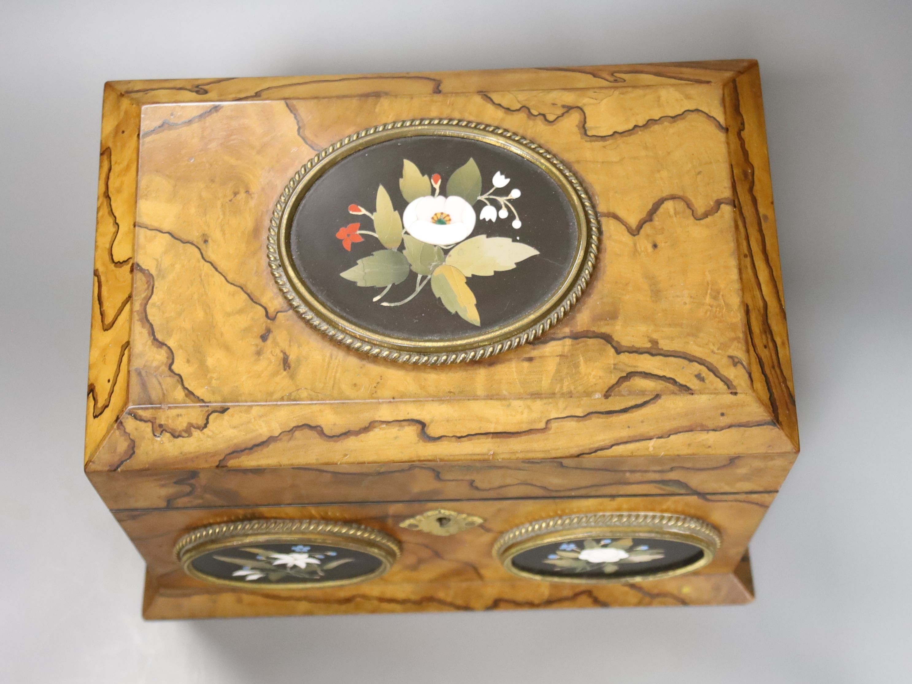 A Victorian olive wood and Ashford pietra dura mounted stationary box, retailed by Payne & Son, Lowndes St and original figuring, 24cm